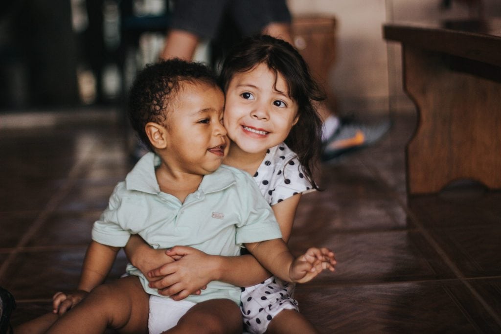 Children Girl And Boy Cuddling Children Girl And Boy Cuddling